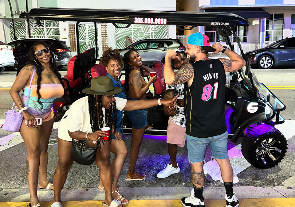 Photo of group of people having fun on a golf cart tour of South Beach in Miami Beach, FL